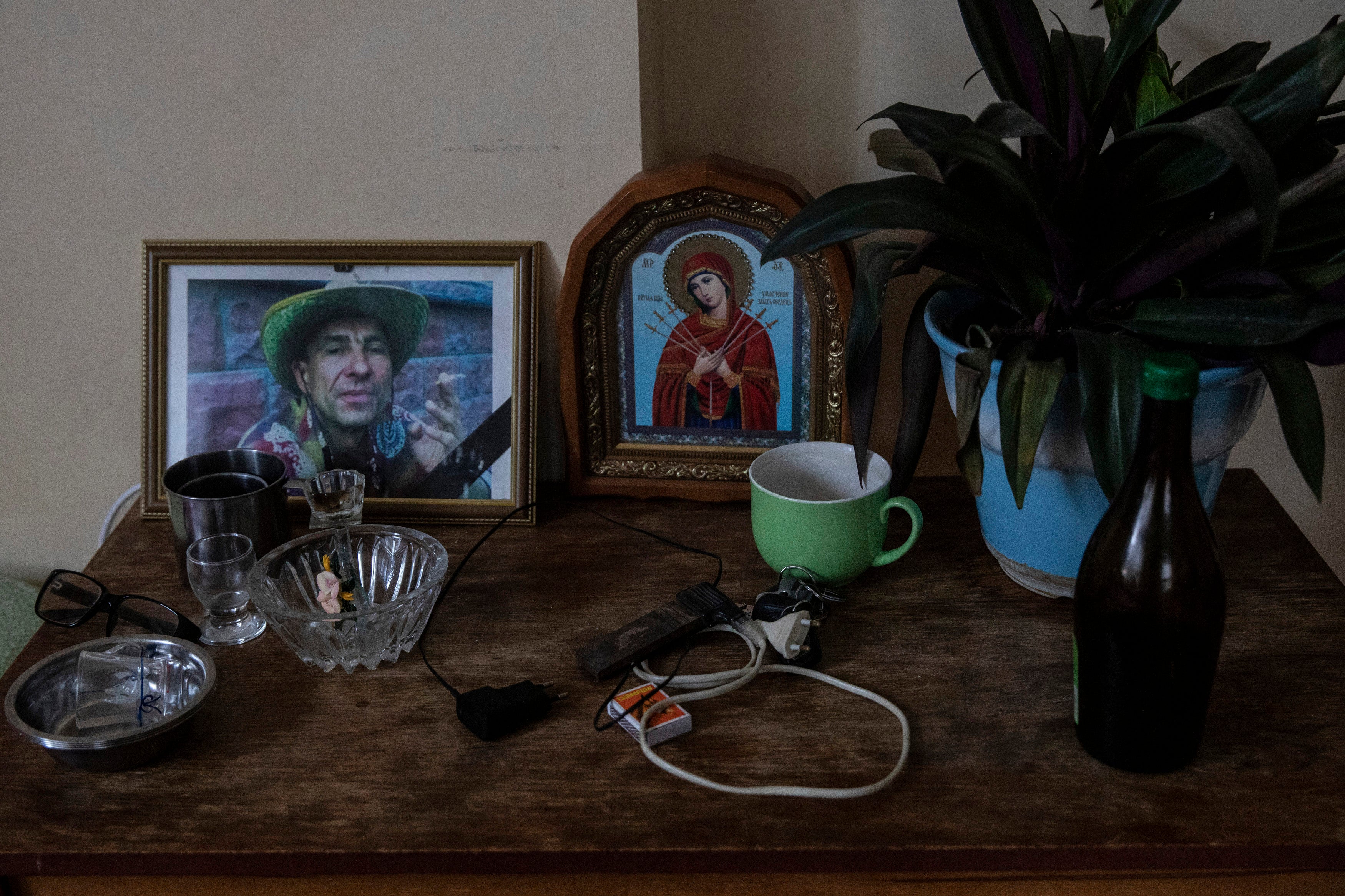 A photo of Victor Prykhodko sits with other belongings inside the family's home in Vorzel