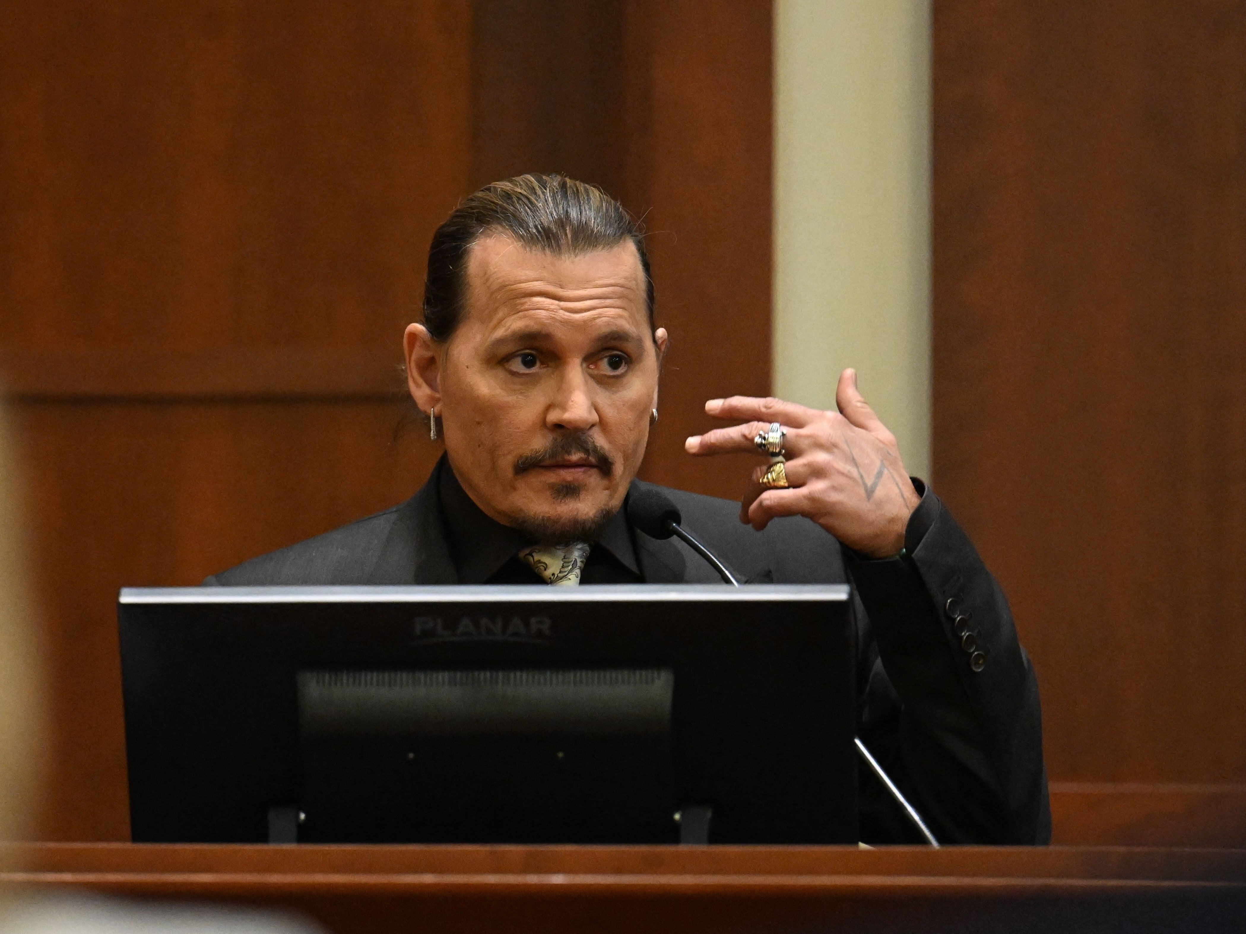 Depp testifying during his defamation trial on 19 April 2022