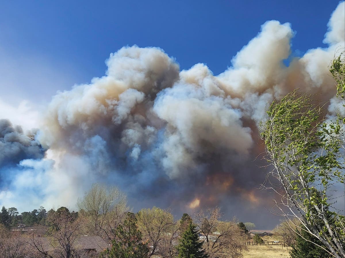 Arizona town evacuated as 100ft ‘wall of fire’ descends and blaze doubles in size overnight