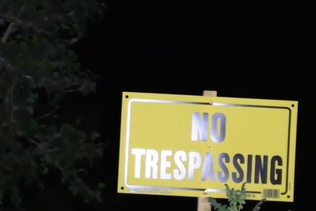 <p>A ‘No trespassing’ sign in Lake Hughes, California </p>
