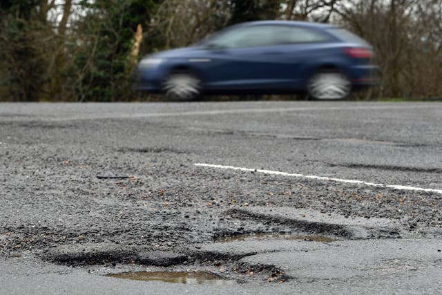 Fixing roads and pavements should be a top priority for councils, a new poll has found (Joe Giddens/PA)