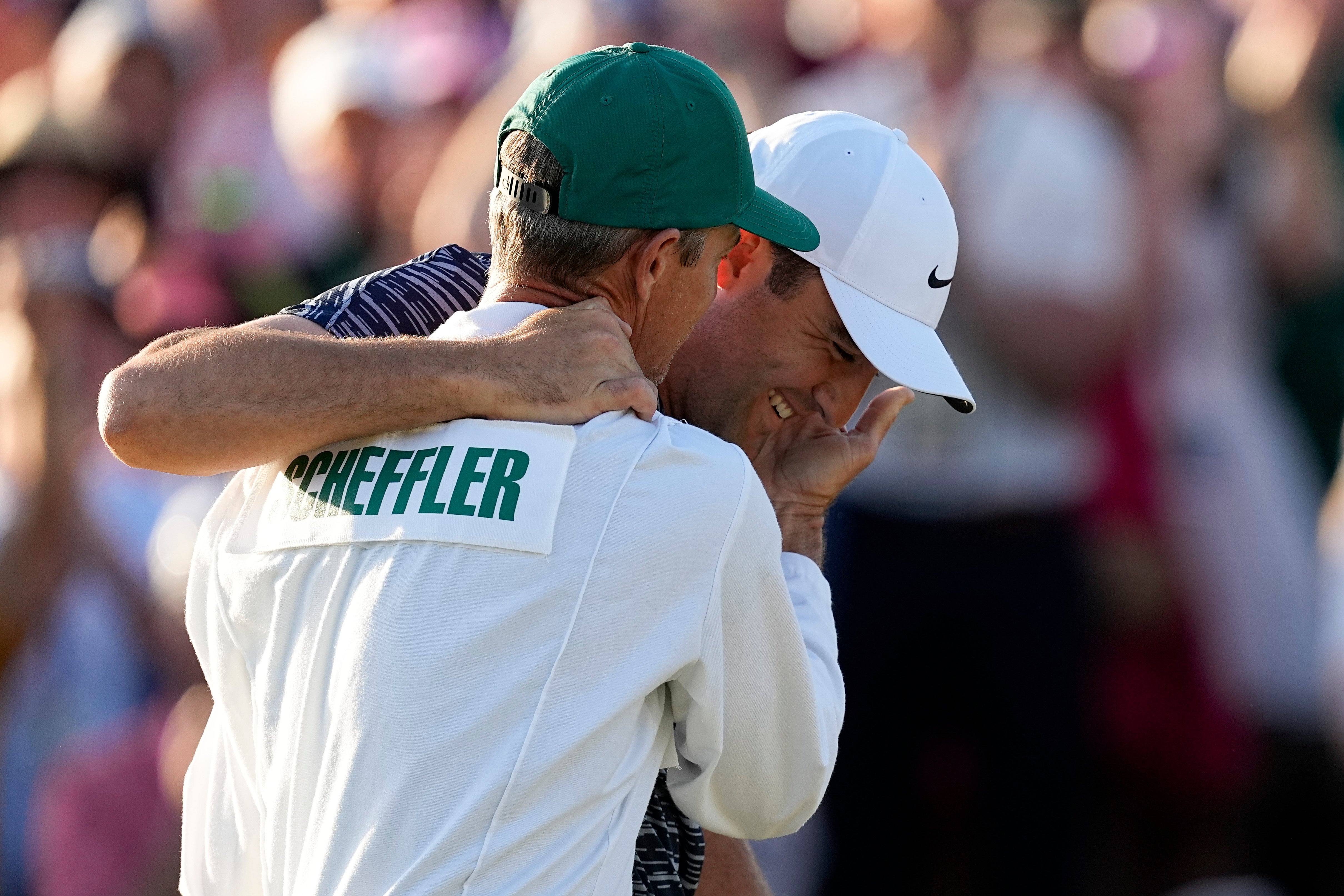 Scottie Scheffler hugs his caddie Ted Scott after winning the 86th Masters (Robert F. Bukaty/AP)