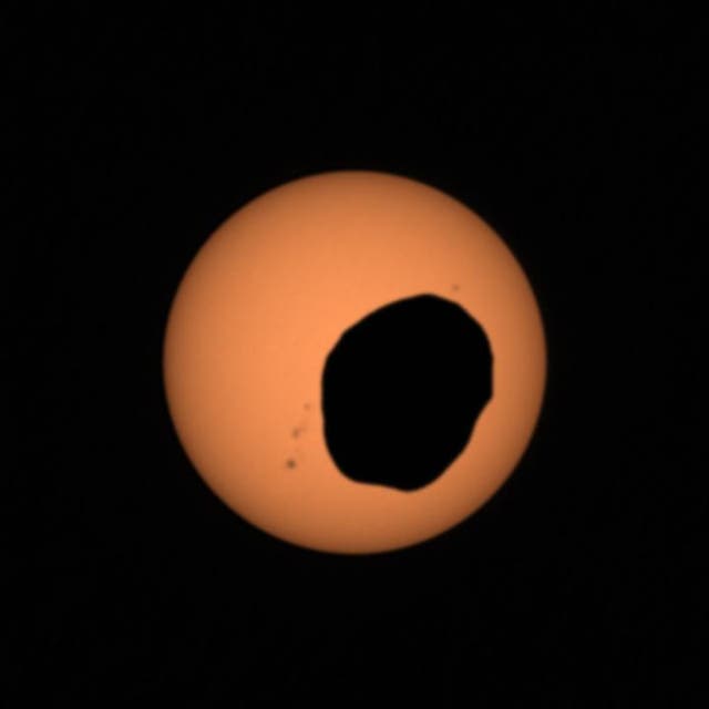 <p>The Martin moon Phobos passes in front of the Sun in an image taken by Nasa’s Perseverance rover on the Red Planet</p>