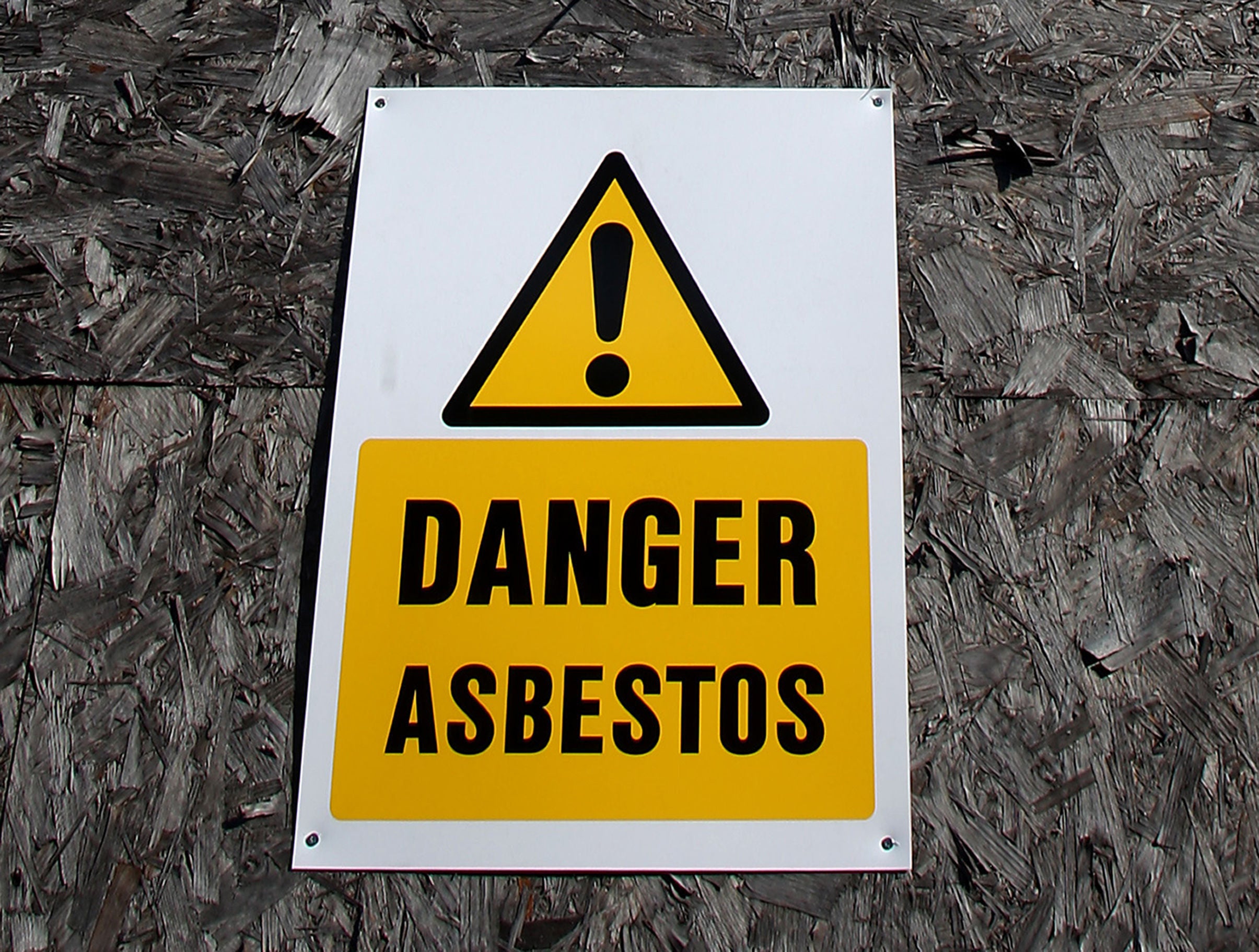 An asbestos warning sign (Stephen Pond/PA)