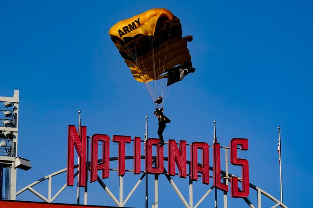 <p>The U.S. Army Parachute Team the Golden Knights descend into National Park before a baseball game between the Washington Nationals and the Arizona Diamondbacks Wednesday, April 20, 2022, in Washington. </p>