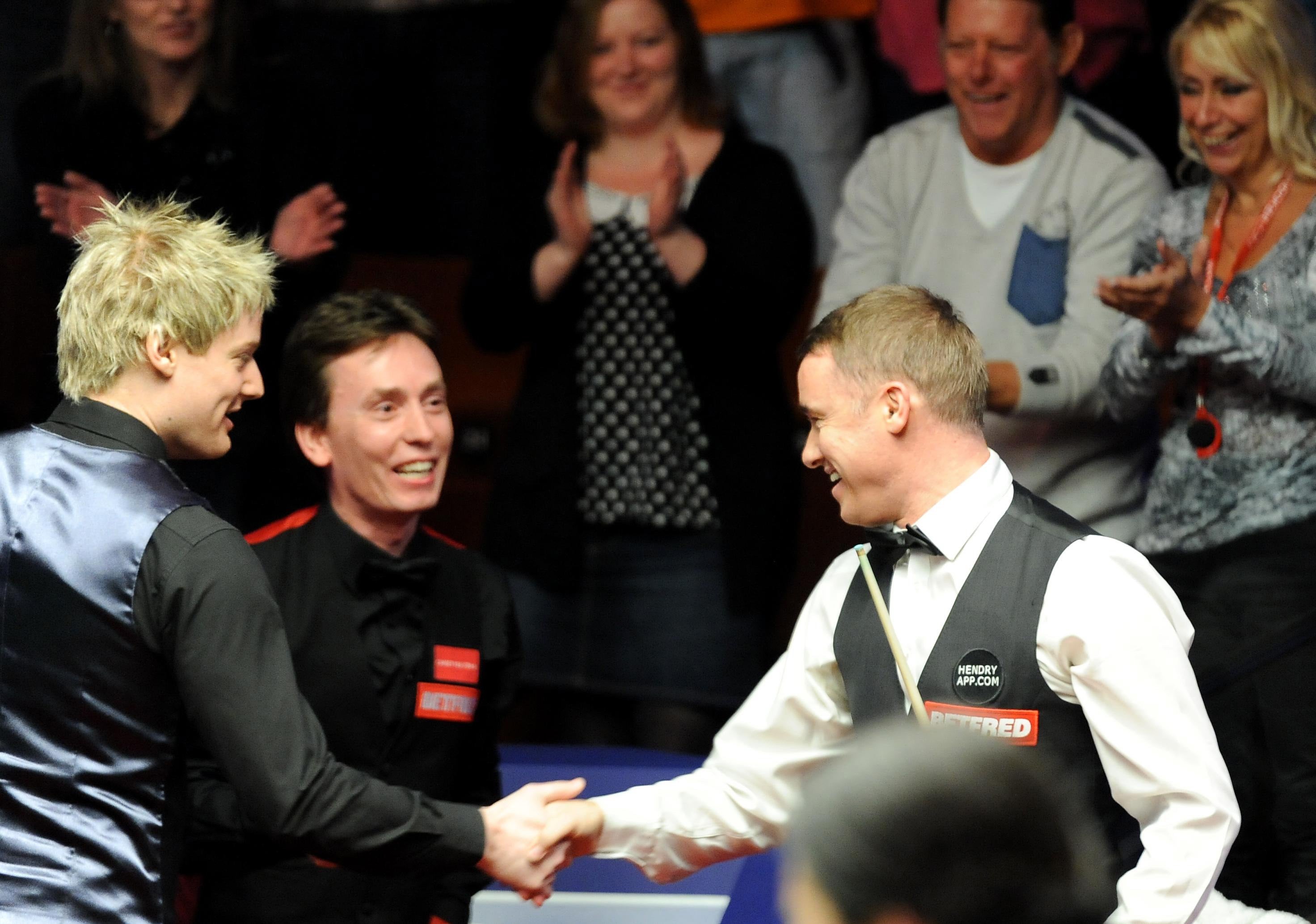 Neil Robertson, left, and Ken Doherty, centre, paused their match to watch Stephen Hendry (Anna Gowthorpe/PA)
