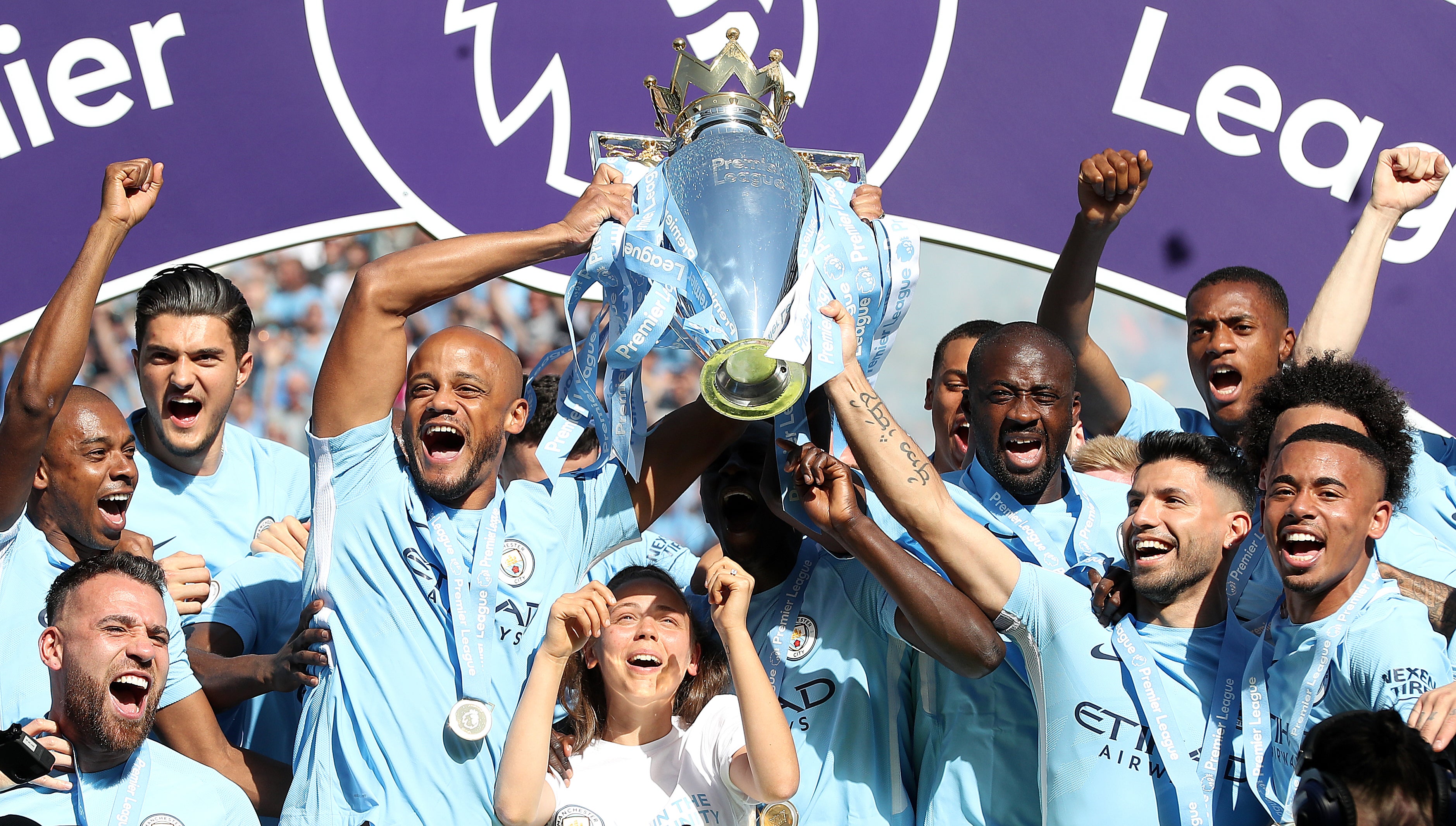 Vincent Kompany, left, and Sergio Aguero, right, lift the Premier League trophy together (Martin Rickett/PA)