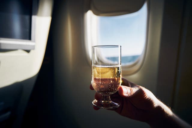 <p>One Delta passenger alleged that crew were offering champagne to ‘celebrate’ no masks</p>