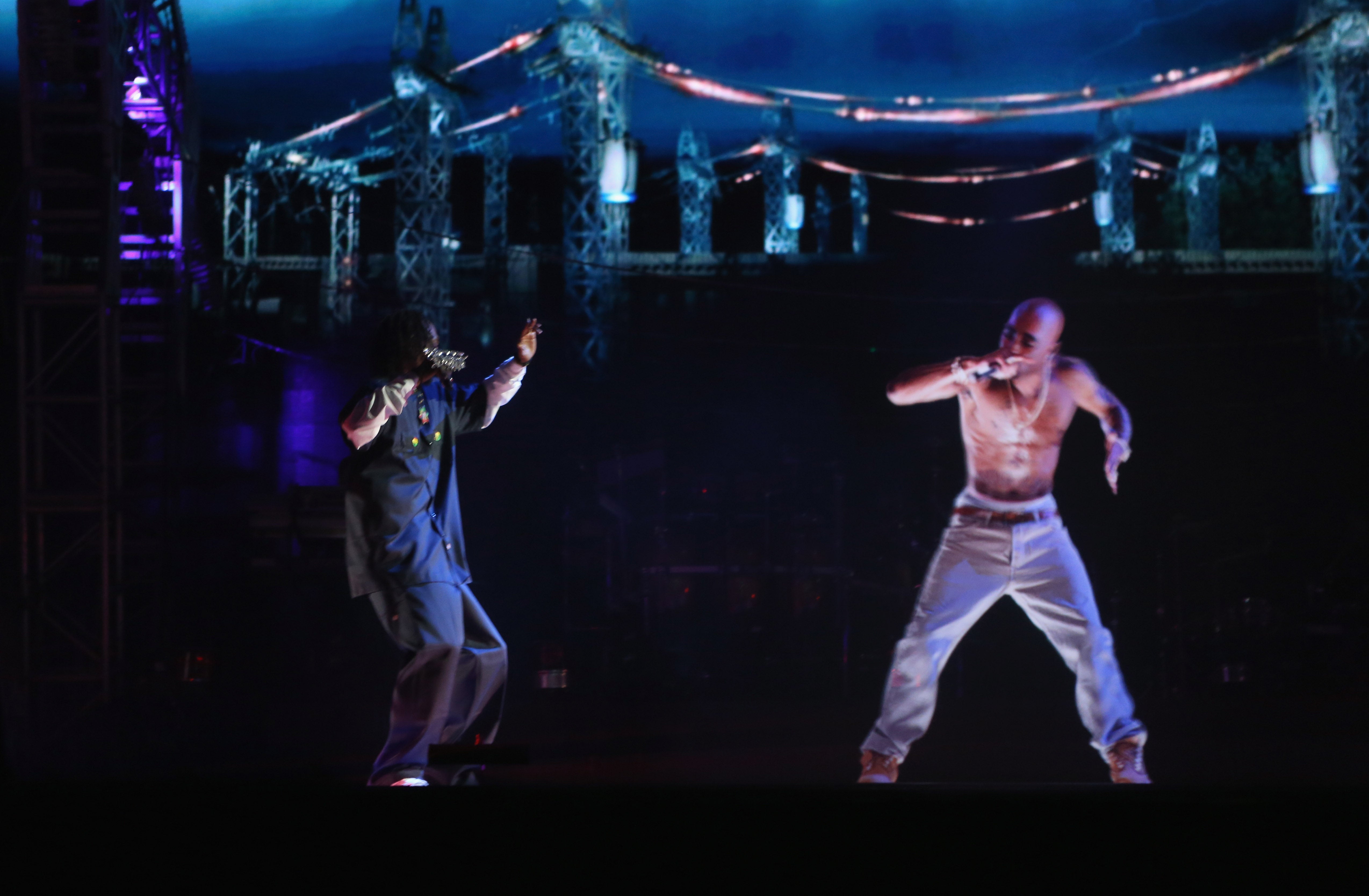 Rapper Snoop Dogg, left, and a hologram of Tupac Shakur perform onstage at the 2012 Coachella Festival