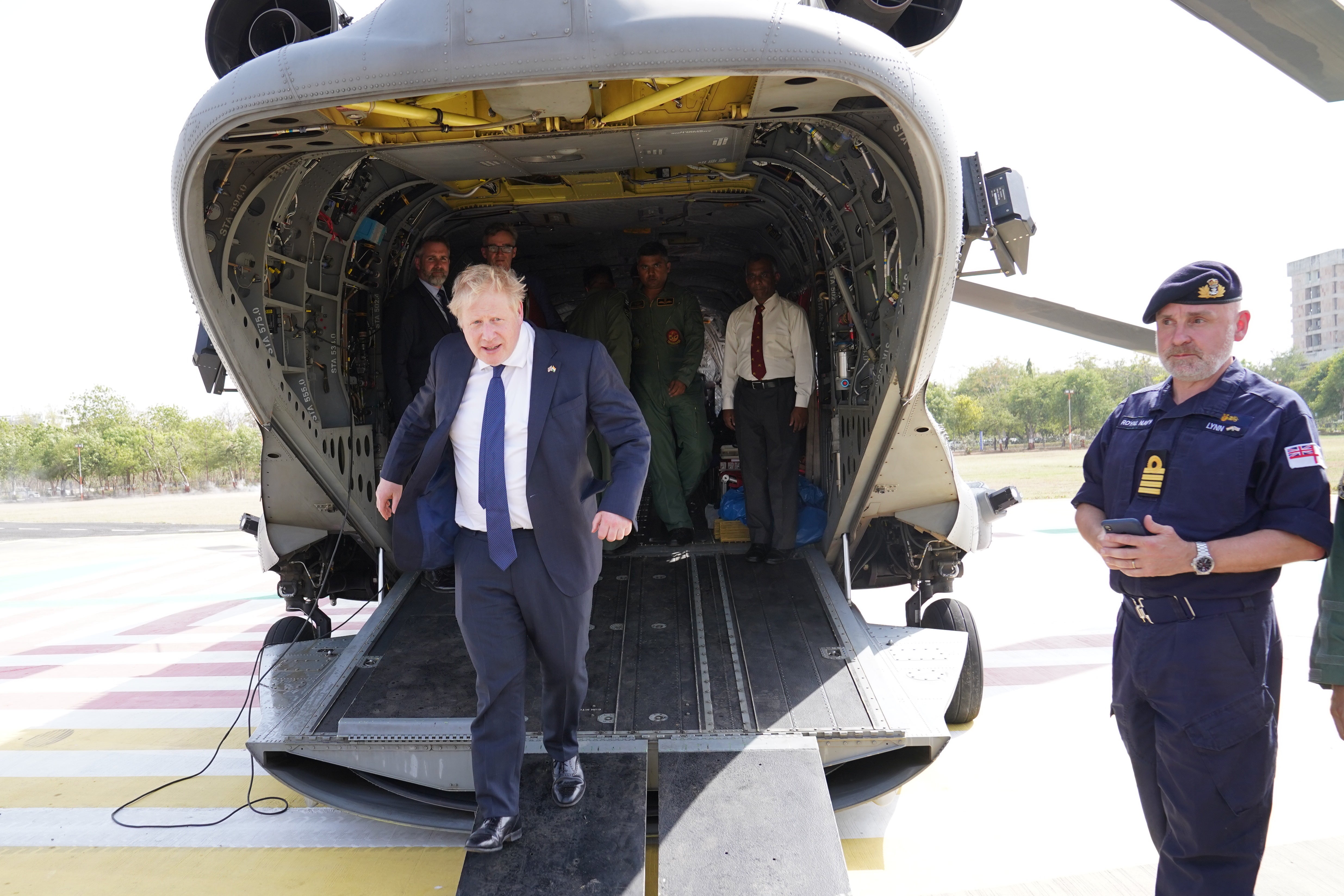 Boris Johnson exits an Indian military Chinook in Ahmedabad after a flight from the JCB factory (Stefan Rousseau/PA)