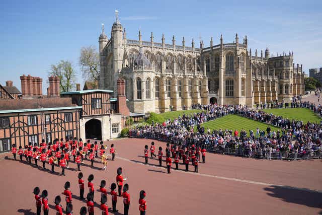 The Band of the Coldstream Guards (left), plays Happy Birthday to mark the 96th birthday of the Queen (Jonathan Brady/PA)