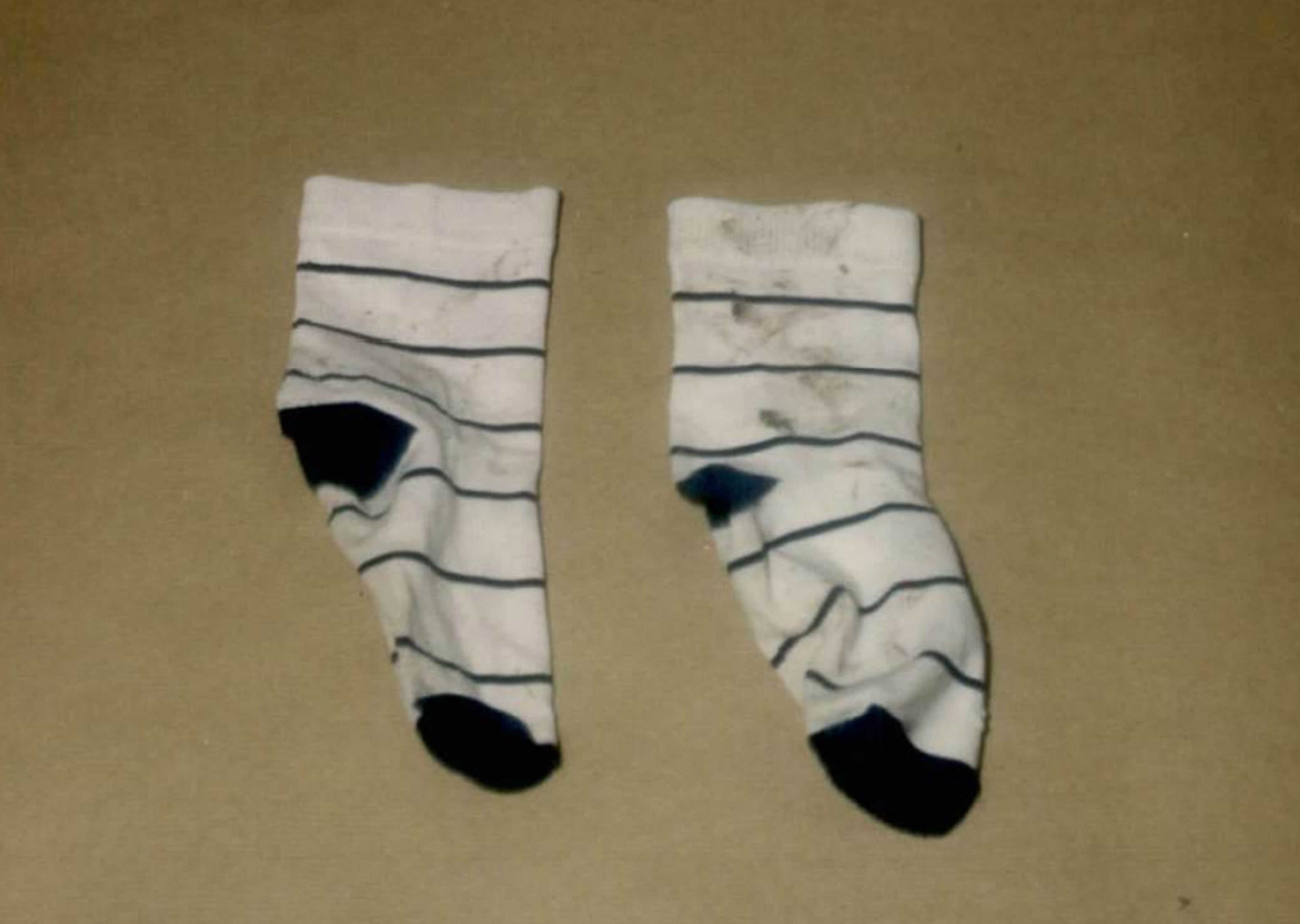 Socks Rikki was wearing when he was killed were recovered from a bin (Crown Prosecution Service/PA)