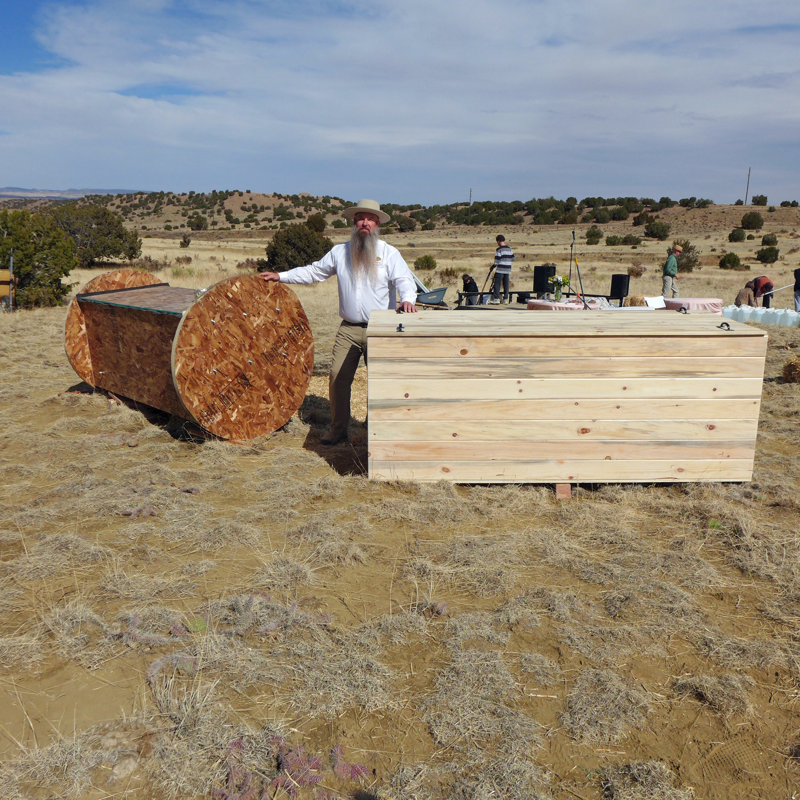 Seth Viddal, who co-owns The Natural Funeral in Colorado, stands between two specially-made chrysallises - which compost human remains
