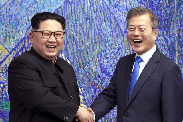 <p>North Korean leader Kim Jong-un laughs with South Korean president Moon Jae-in in 2018 </p>
