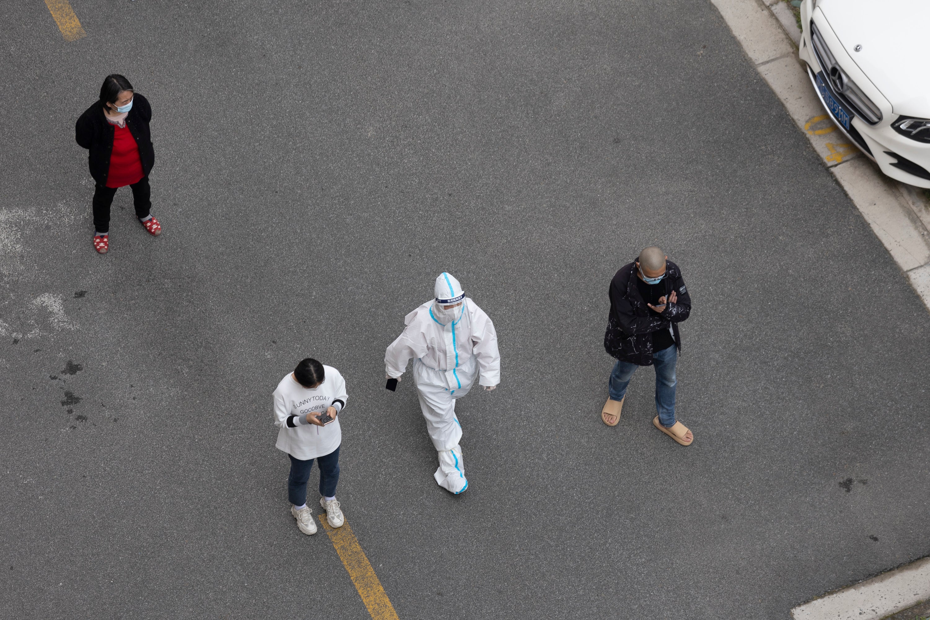 People line up for a Covid-19 test at a residential area on 22 April 2022 in Shanghai, China