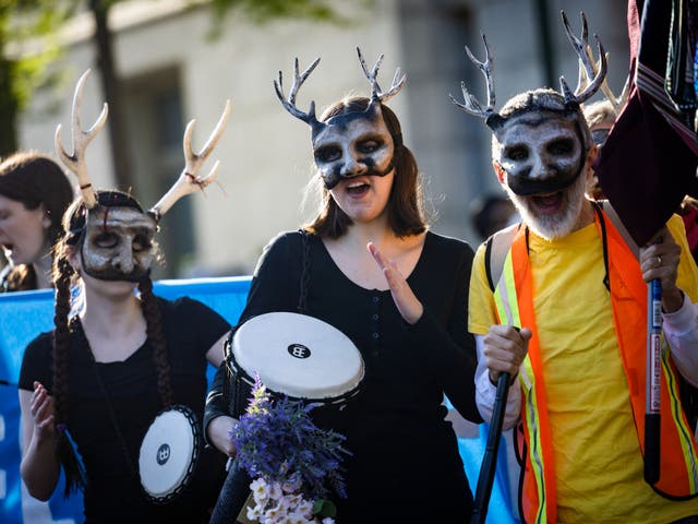 <p>Extinction Rebellion activists march to the Wilson Building, the seat of DC’s local governance, for an Earth Day protest to ‘stop all new fossil fuel infrastructure in the nation’s capital'</p>