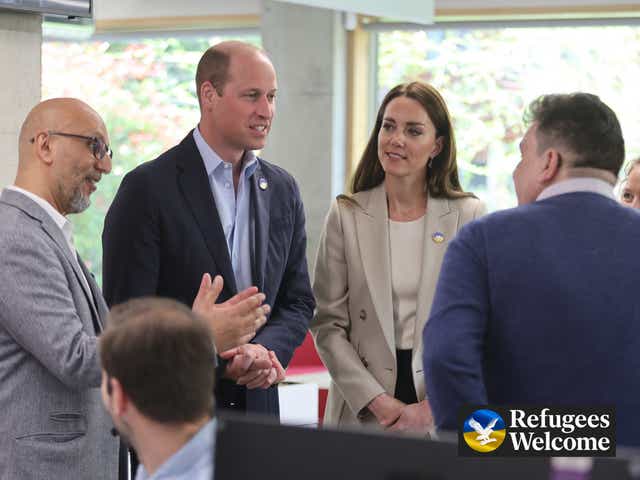 <p>The duke and duchess speak to staff at the DEC offices in London on Thursday </p>