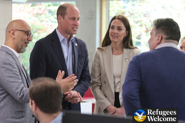 <p>The duke and duchess speak to staff at the DEC offices in London on Thursday </p>