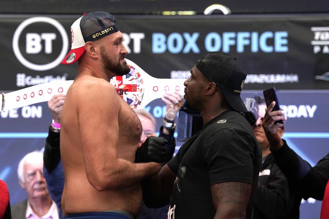 Tyson Fury (left) and Dillian Whyte weighed in on Friday ahead of their Wembley showdown (Nick Potts/PA)