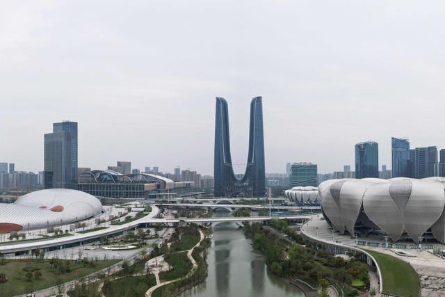 <p>This aerial photo taken on April 1, 2022 shows the Hangzhou Olympic Sports Centre Stadium (R) and Hangzhou Olympic Sports Centre Gymnasium (L), venues of the 19th Asian Games, in Hangzhou in China's eastern Zhejiang province</p>