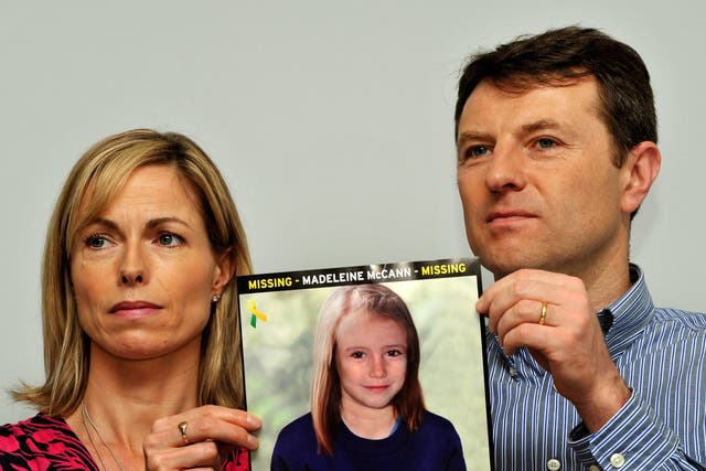 <p>Kate and Gerry McCann with a missing person poster showing an image of what Madeleine might have looked like aged 9 </p>