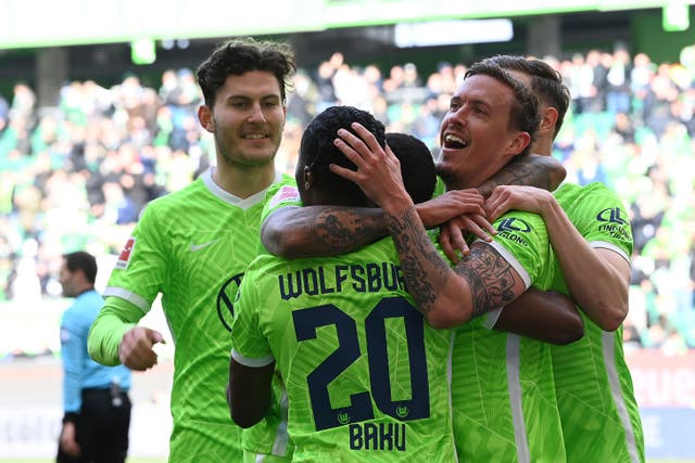 Wolfsburg’s Max Kruse, right, has 11 Bundesliga goals for the season (Swen Pfoertner/dpa via AP)