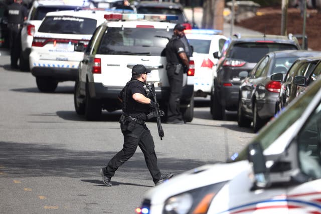 <p>Washington DC Metropolitan Police and US Secret Service at the scene of a reported shooting near the Edmund Burke School in Northwest Washington, DC, USA, 22 April 2022.  </p>