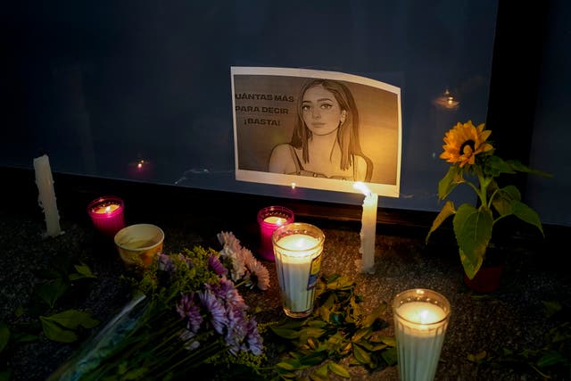 <p>Candles and flowers surround an image of Debanhi Escobar during a protest against her disappearance in Mexico </p>
