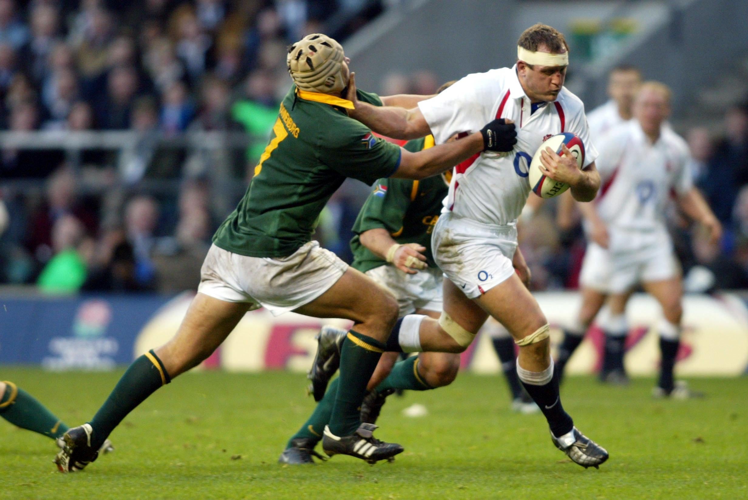 South Africa’s Pedrie Wannenburg (left) tackles England’s Richard Hill (Tom Hevezi/PA)