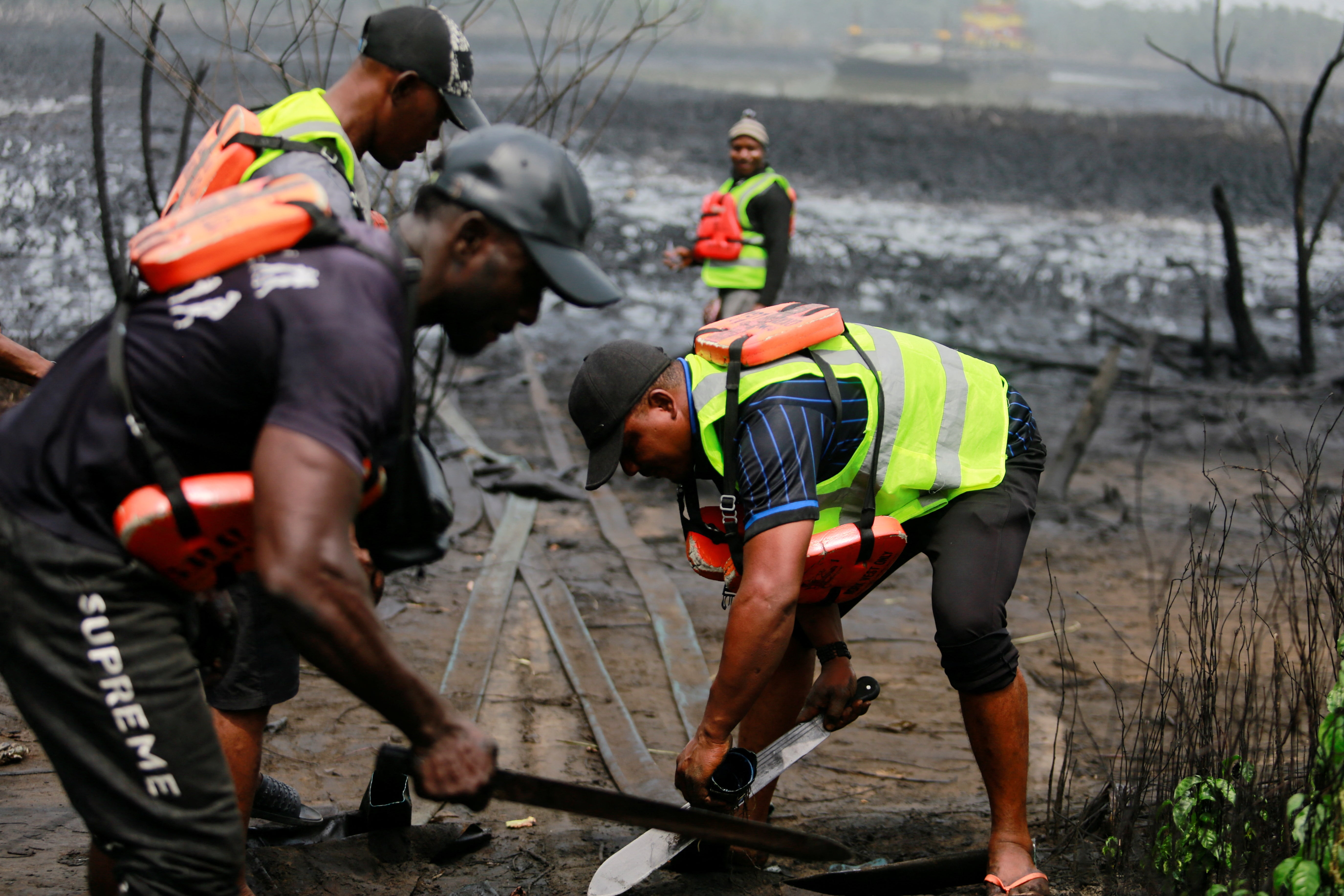 Members of a Nigerian task force clearing an illegal refinery