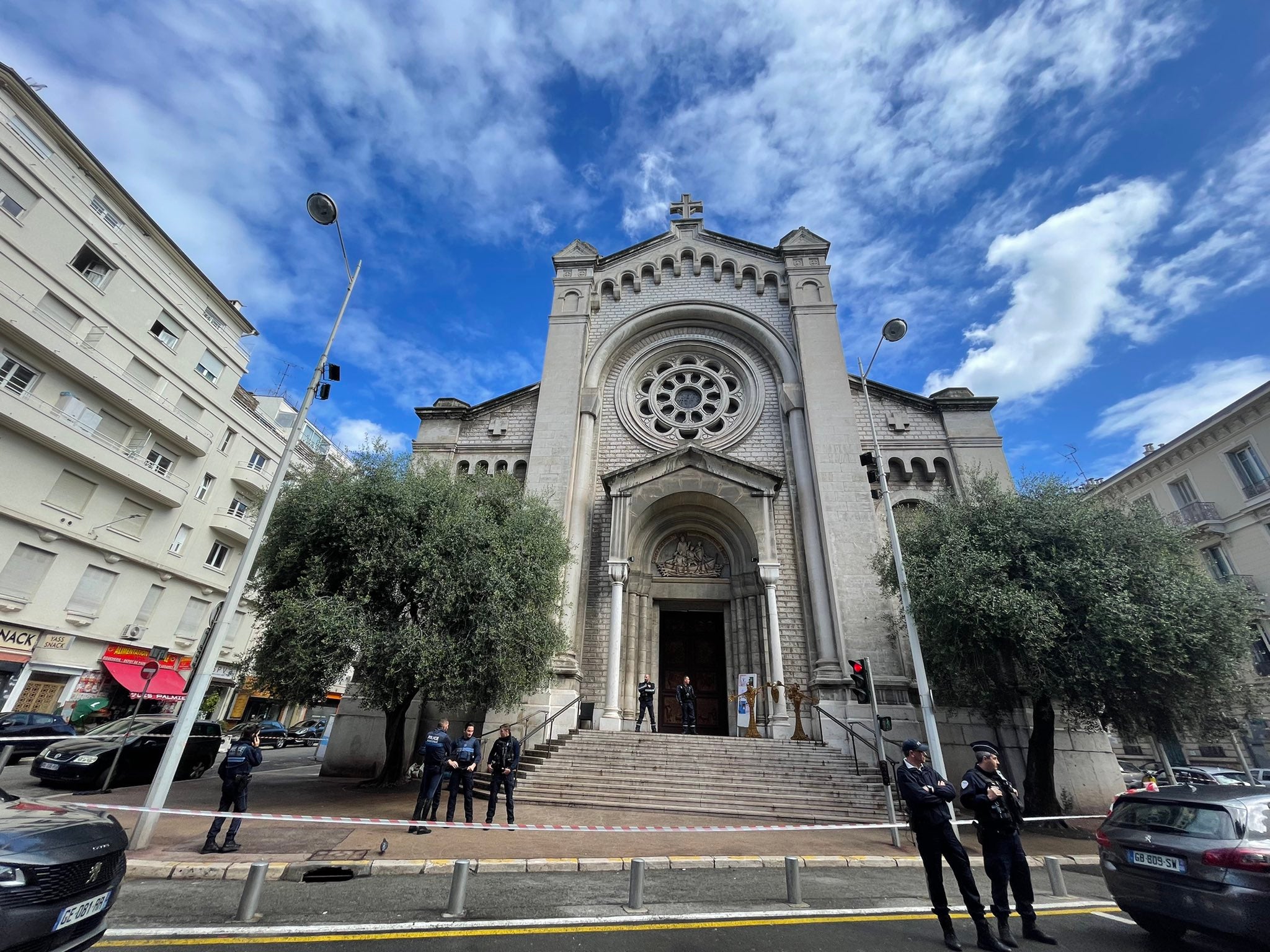 Police cordon the Saint-Pierre d'Arene church following an attack on a priest and a nun in Nice