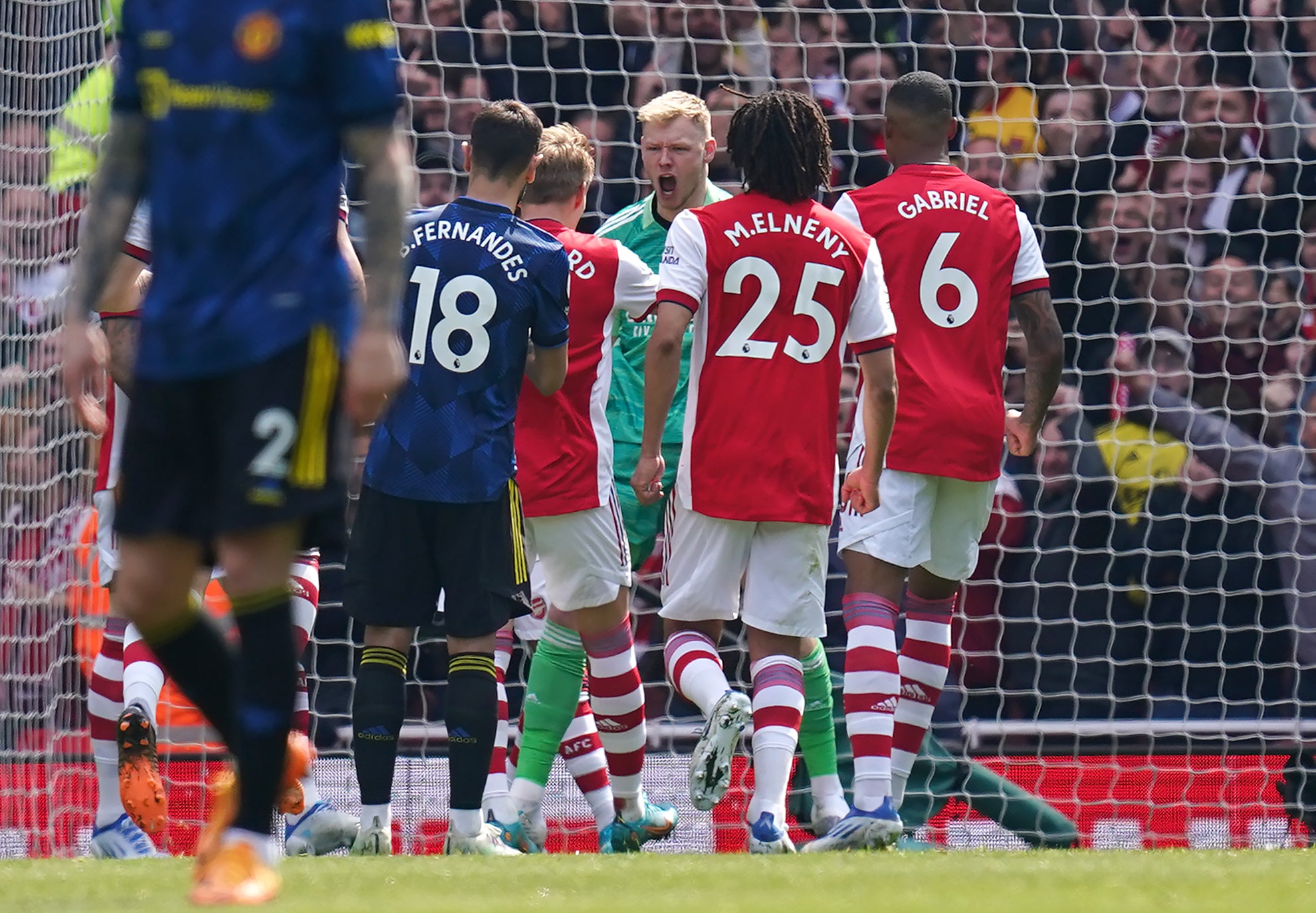 Arsenal goalkeeper Aaron Ramsdale (centre) reacts after Manchester United’s Bruno Fernandes misses a penalty at the Emirates (John Walton/PA)