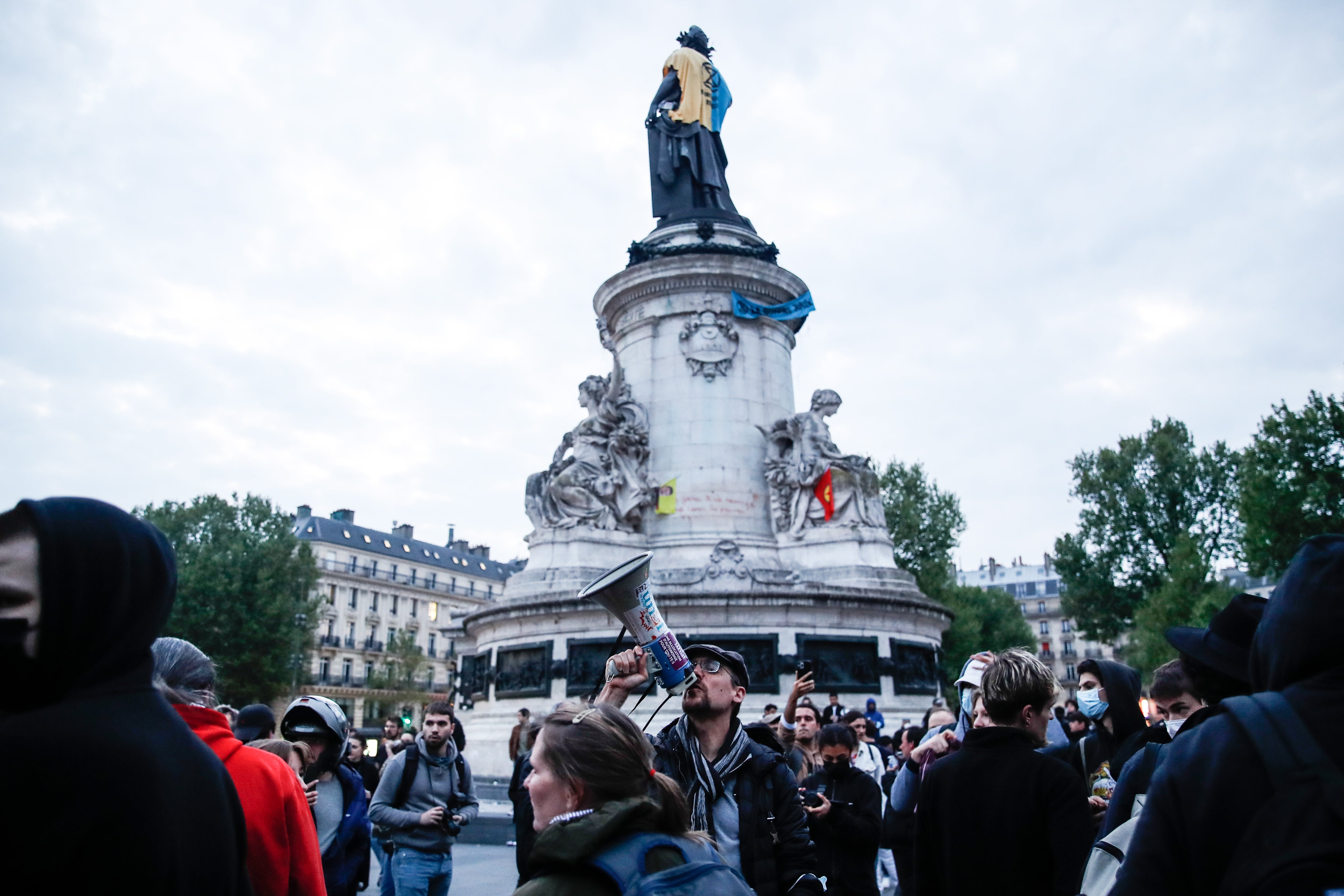 Anarchist activists gather at Place de la Republique in Paris for a protest against French presidential candidates