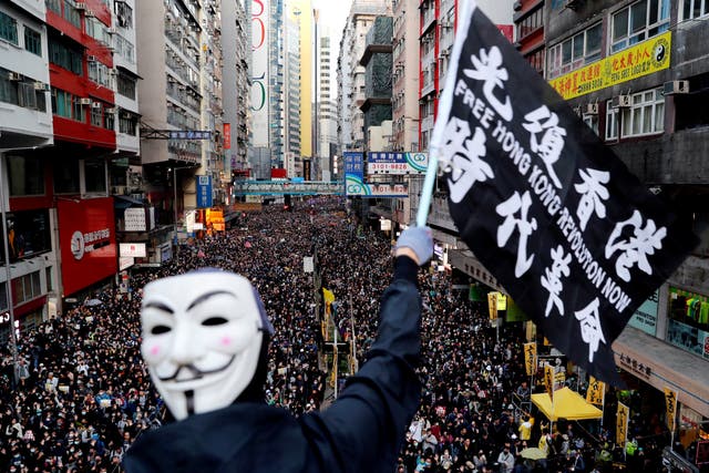 <p>File: Pro-democracy protesters march for human rights in Hong Kong in 2019</p>
