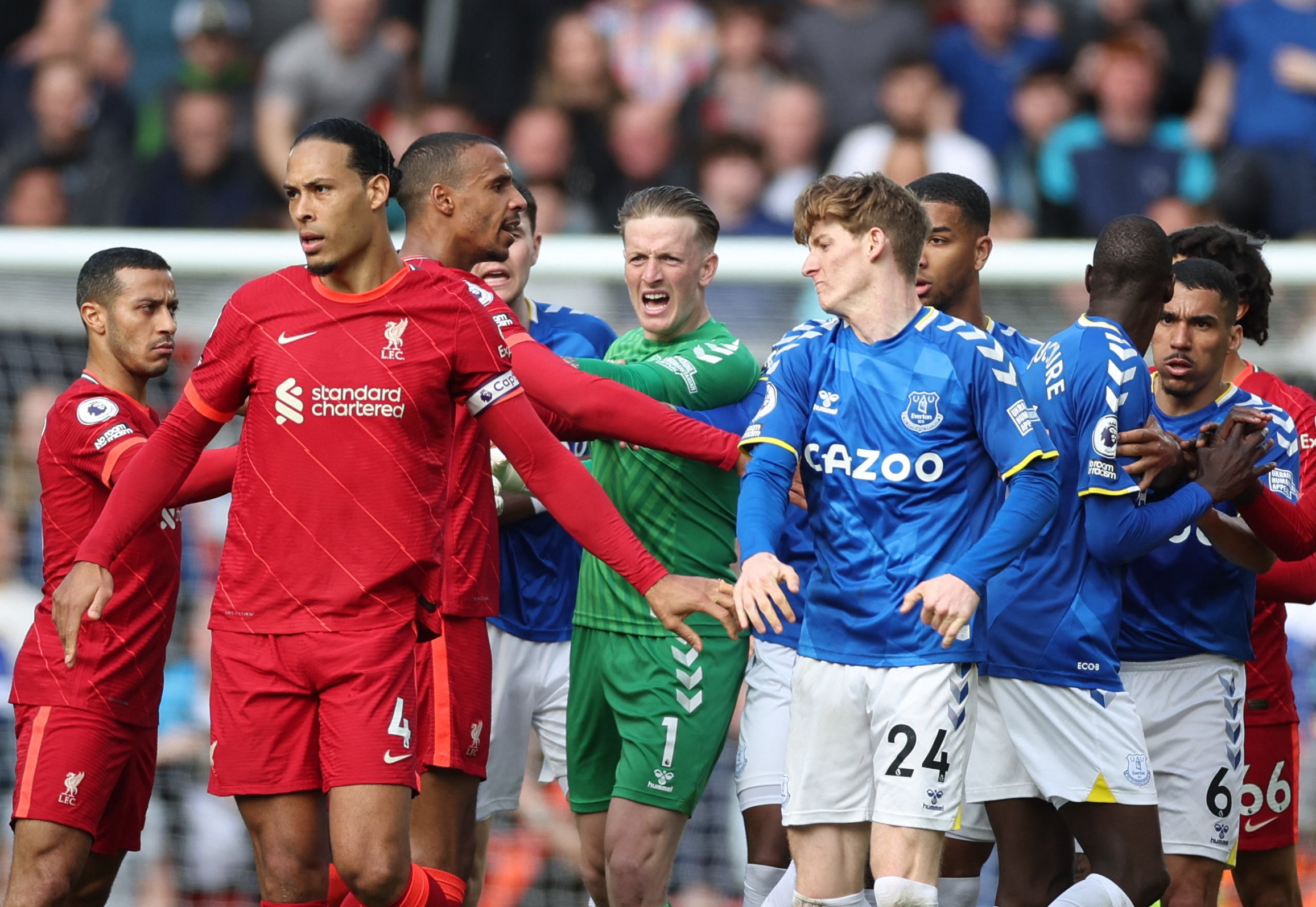 Liverpool's Joel Matip clashes with Everton's Anthony Gordon