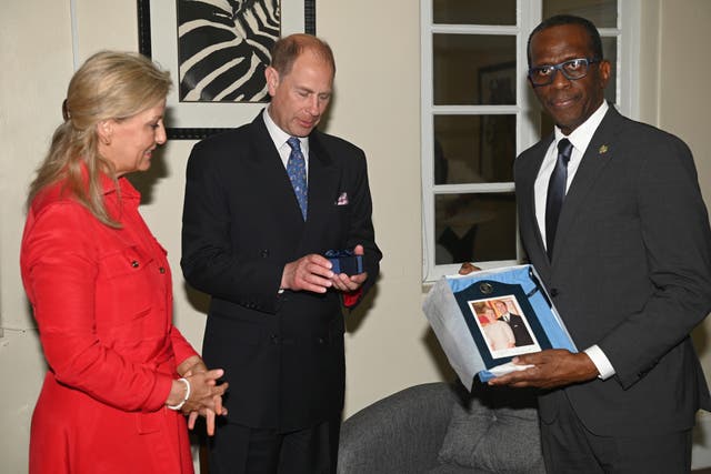 <p>Sophie, Countess of Wessex, Prince Edward, Earl of Wessex and Philip Pierre, Prime Minister of Saint Lucia present gifts to each other during a reception on day one of their Platinum Jubilee Royal Tour of the Caribbean at the Prime Minister’s residence on April 22, 2022 in Castries, Saint Lucia. </p>
