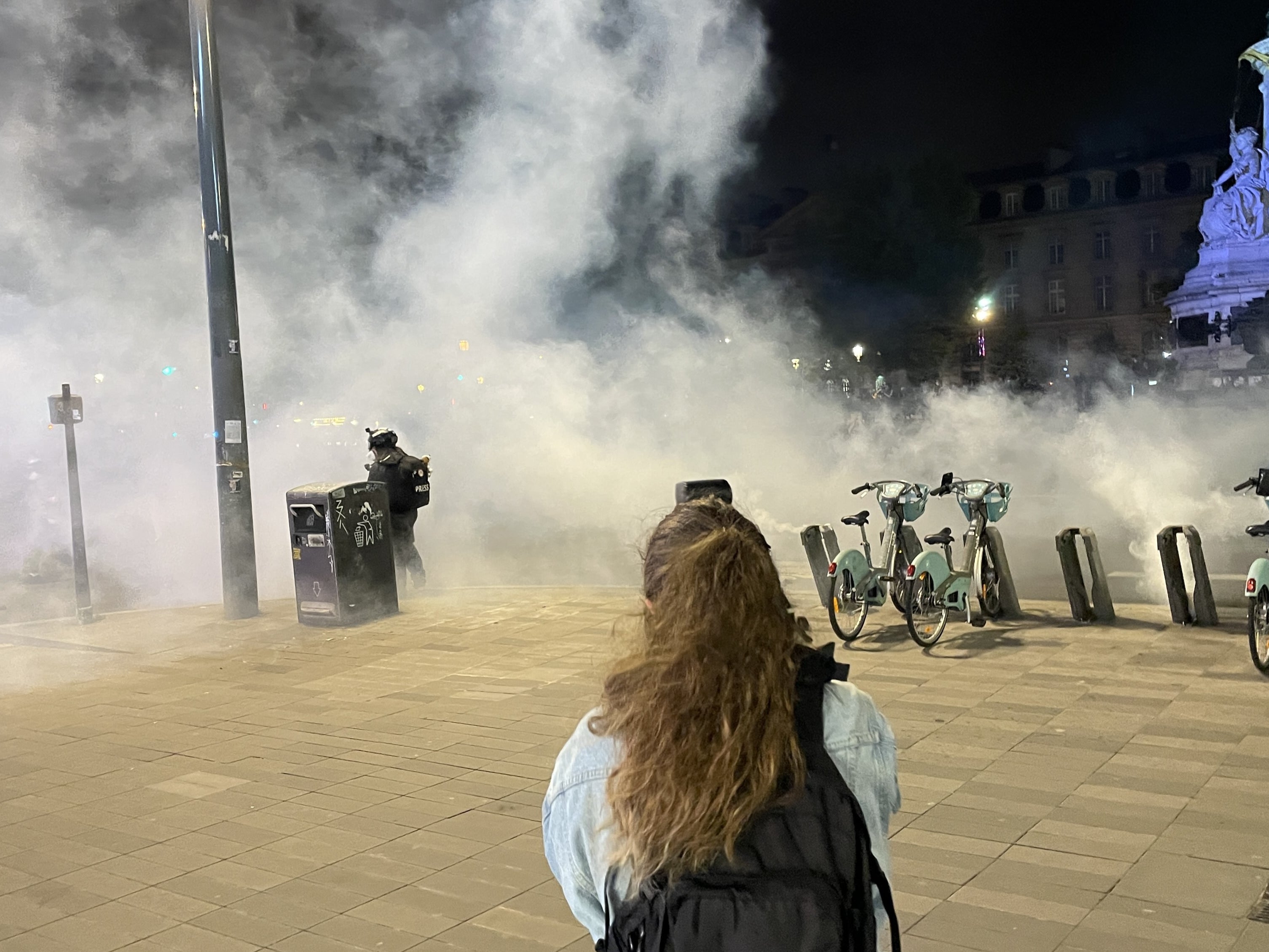 Teargas is used by police to break up crowds of protestors at Place de la République in Paris