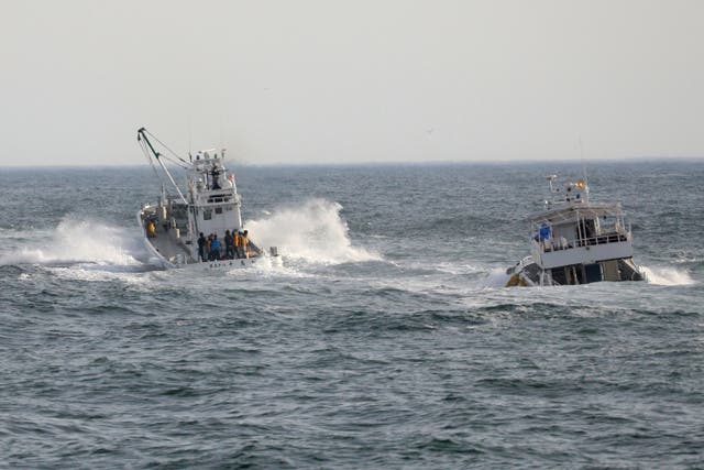 <p>Fishing boats conduct a search operation for missing people aboard the ‘Kazu 1‘ sightseeing boat</p>