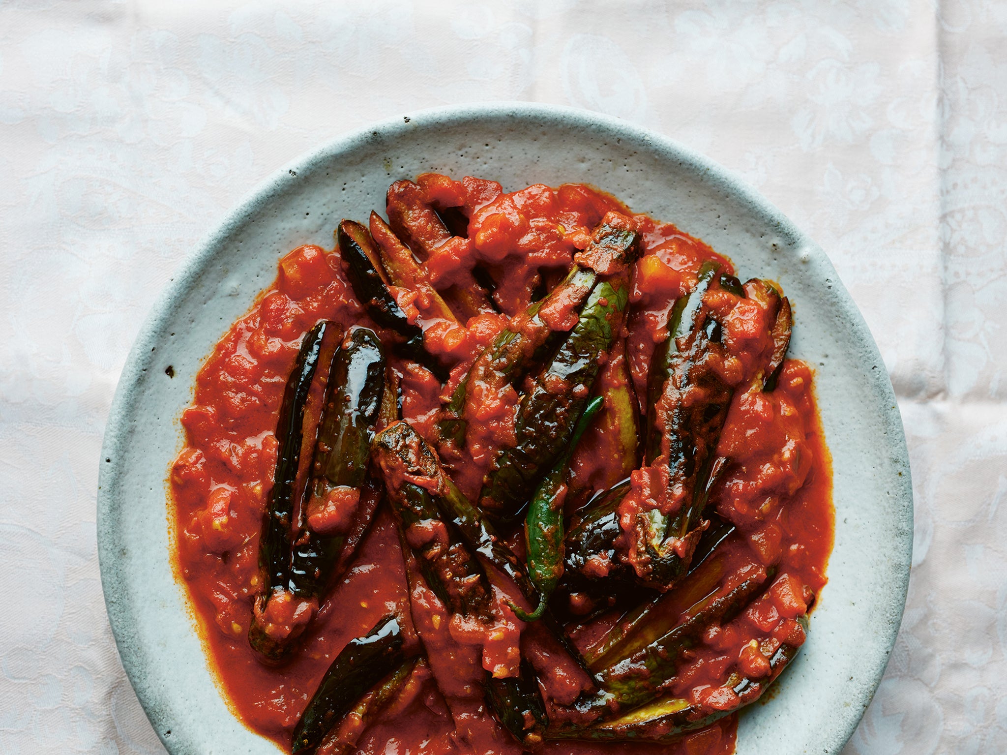Sweet and sour tomatoes work wonderfully well with aubergines in this dish