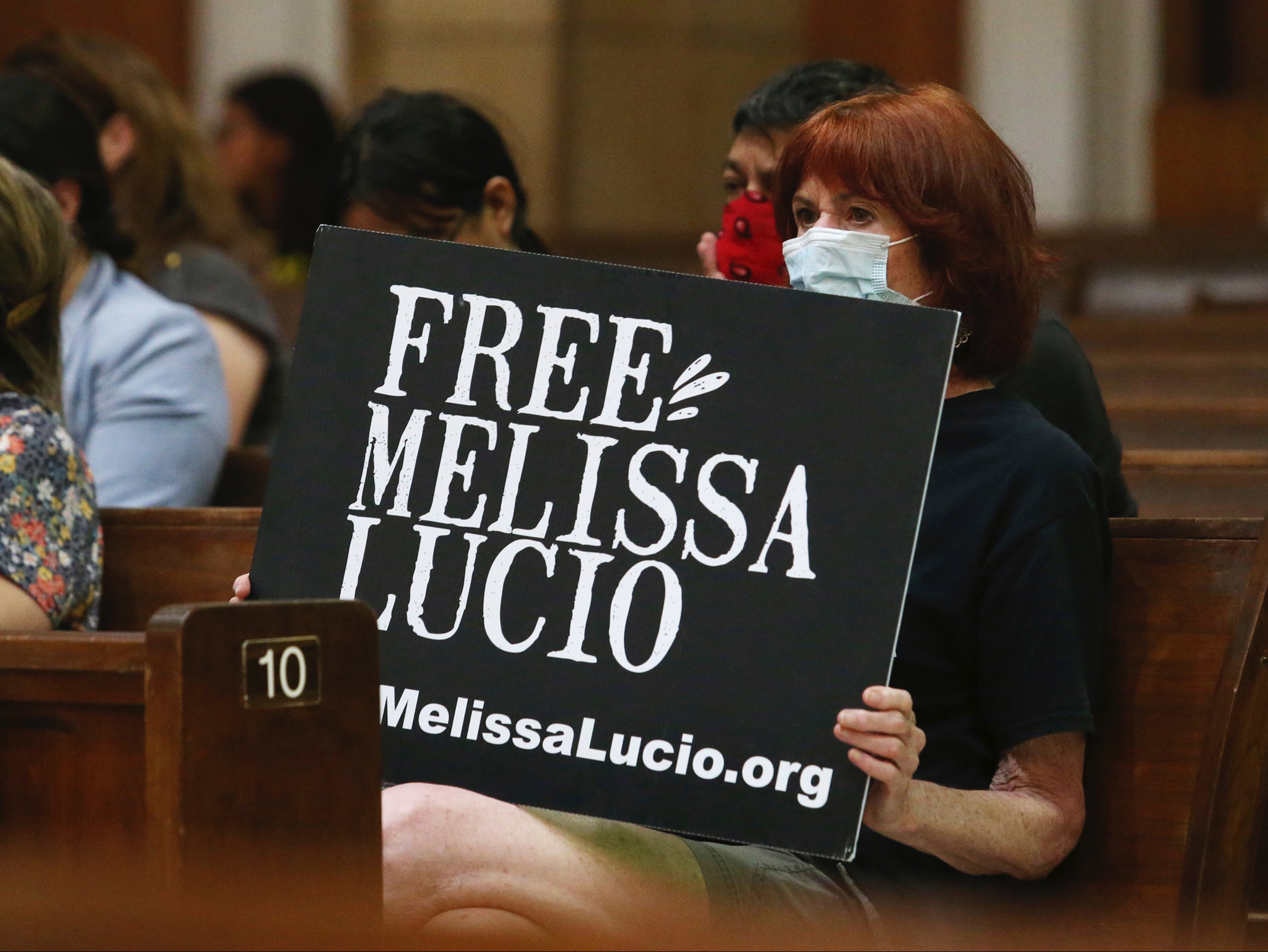 A sign at a vigil for Melissa Lucio