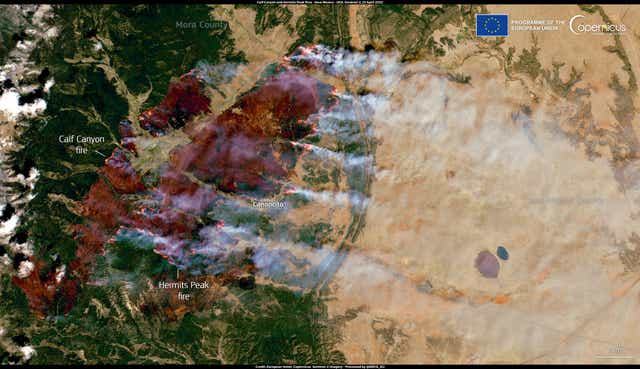 <p>The Calf Canyon and Hermits Peak fires burn through northern New Mexico on April 23, 2022, as captured by satellites</p>