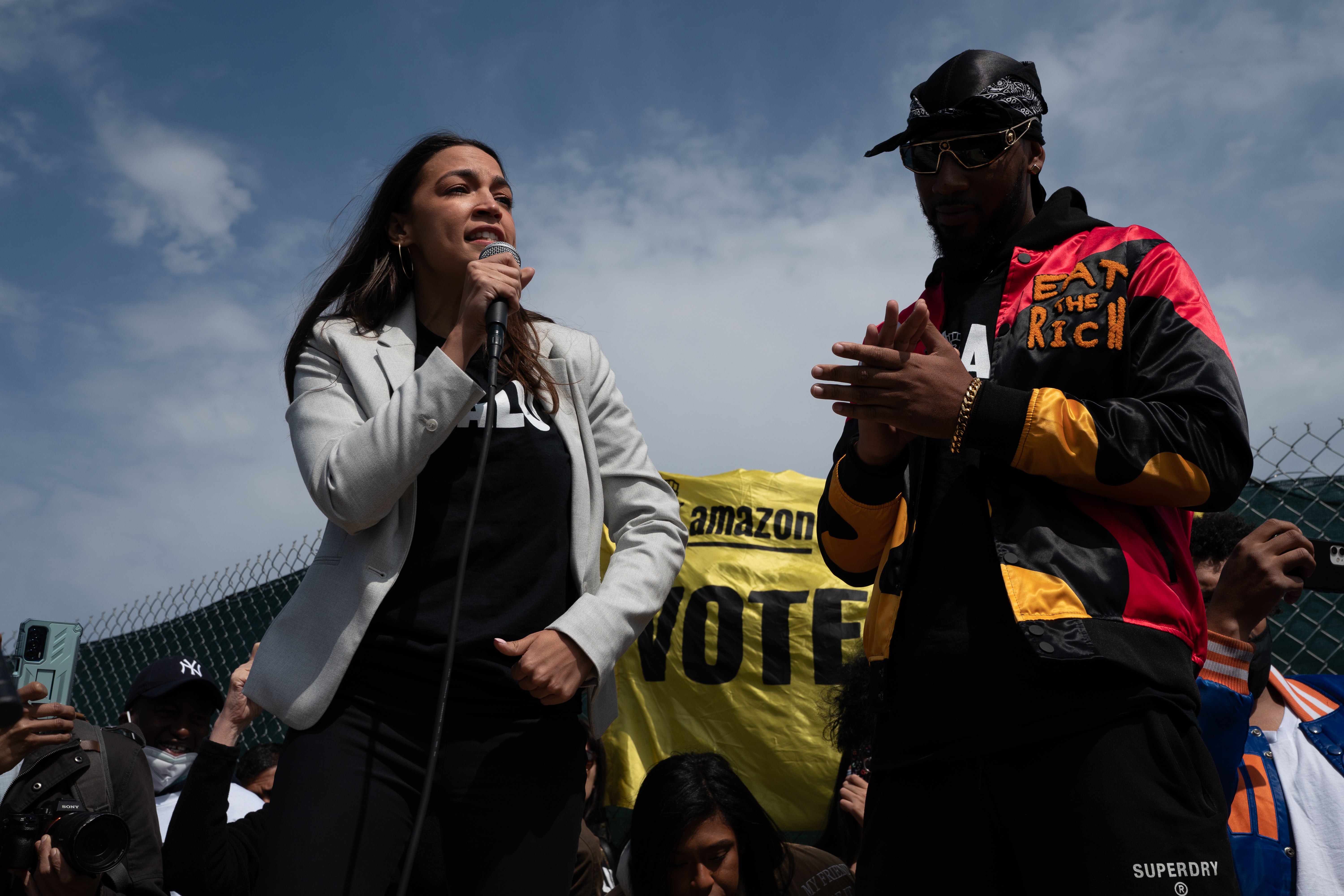 Alexandria Ocasio-Cortez and organiser Chris Smalls at a labor rally on Staten Island