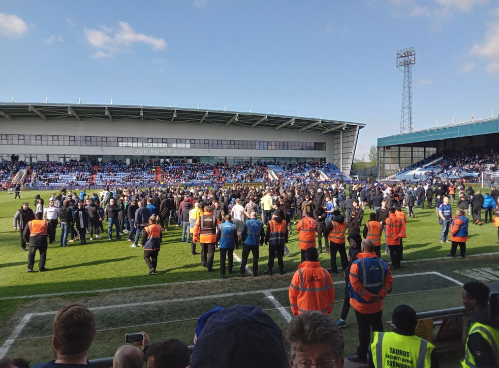 Oldham fans invaded the pitch to protest during the match against Salford (Lee Morris/PA)
