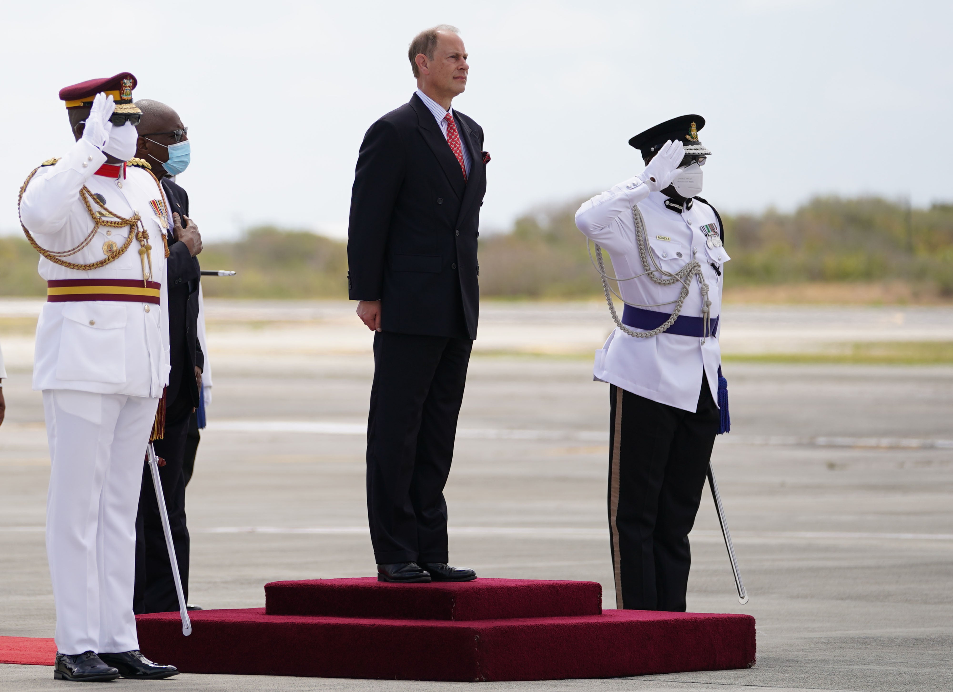 The Earl of Wessex looks at a guard of honour after arriving at VC Bird International Airport (Joe Giddens/PA)