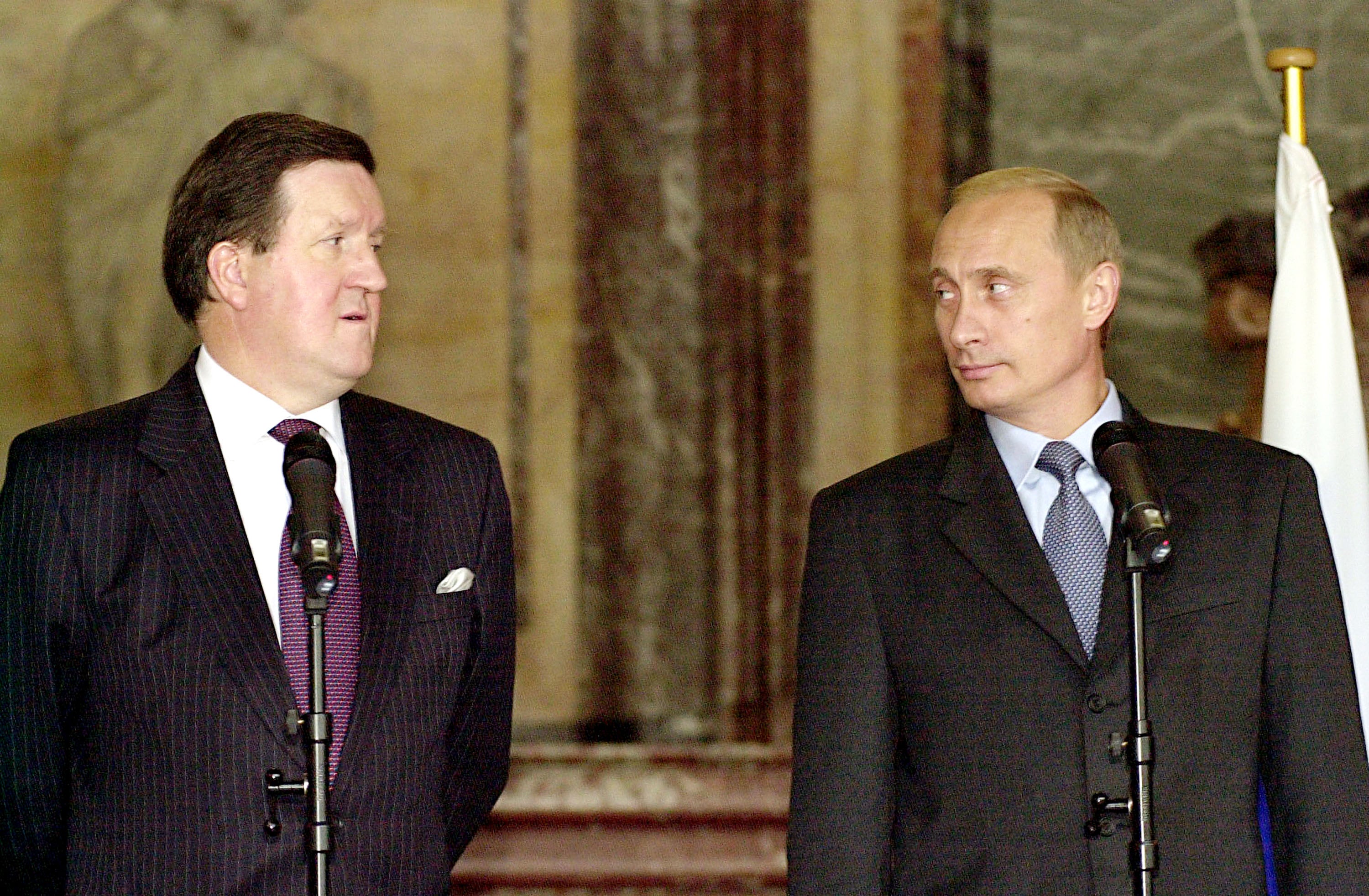 Putin speaks to the press with the Nato secretary general at the Palais d’Egmont in 2001