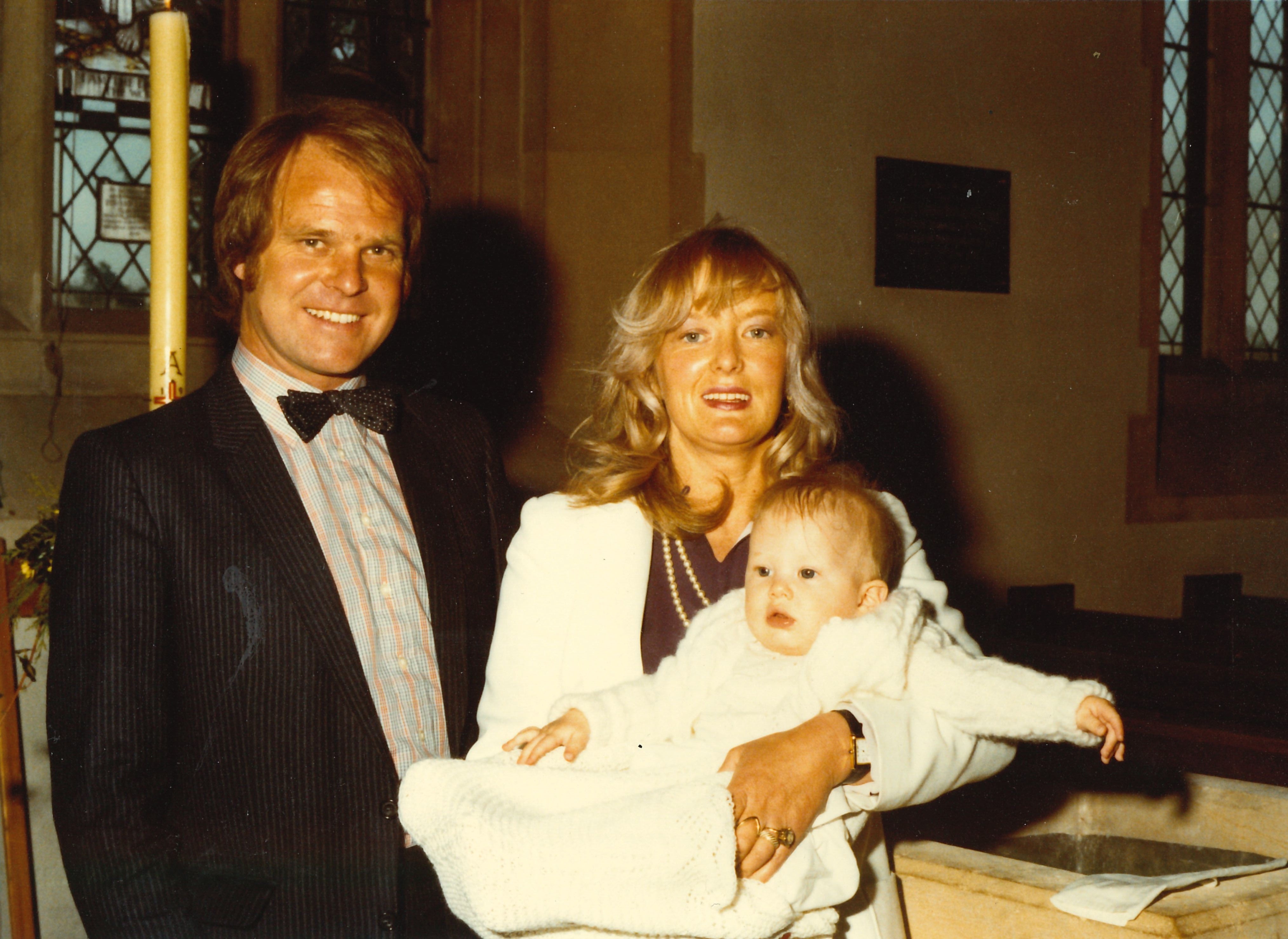 Steve and Gloria Dayman with their son Spencer on his christening day.