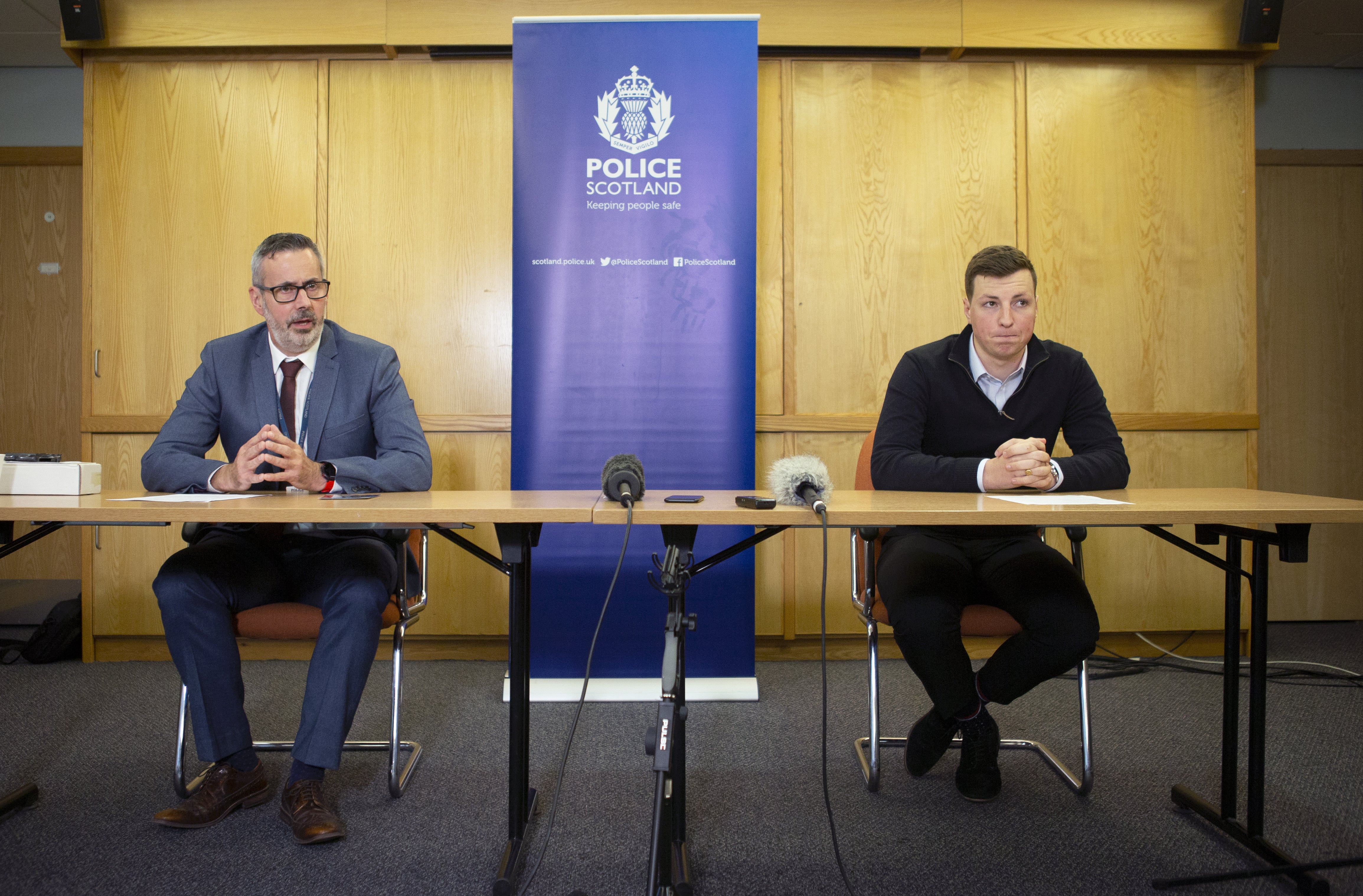 Detective Inspector Gary Winter (left) and Andrew Wilson, 20, son of Alistair Wilson, during a press conference at Inverness police headquarters (Jane Barlow/PA) Media