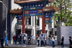 Beijing enforces mass COVID testing, closes neighborhoods 