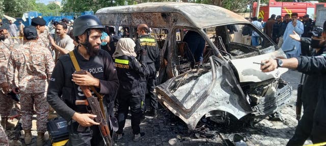 <p>Pakistani security officials inspect the scene of an explosion in Karachi, Pakistan</p>