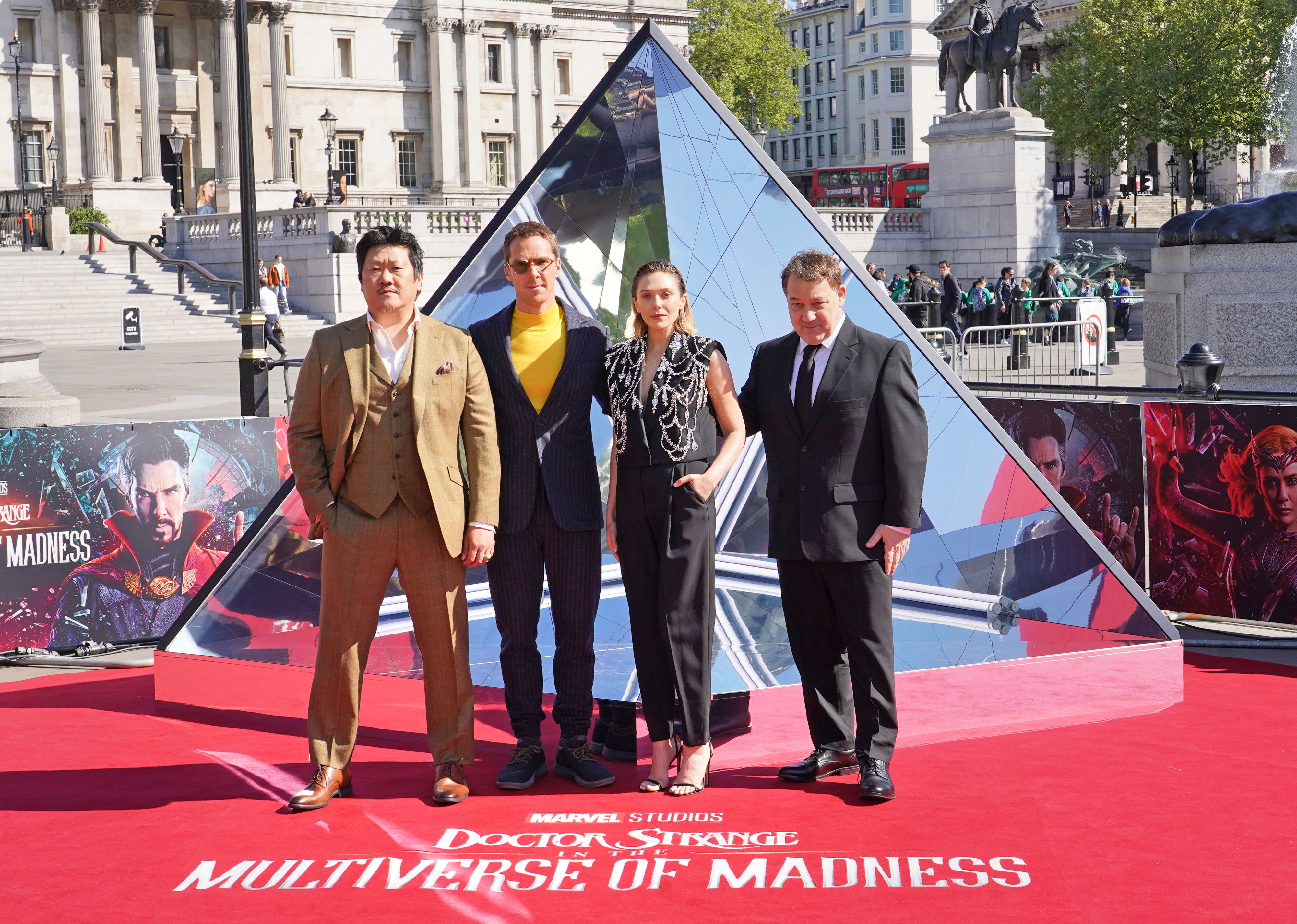 (L to R) Benedict Wong, Benedict Cumberbatch, Elizabeth Olsen and director Sam Raimi at the Doctor Strange And The Multiverse Of Madness photocall in London’s Trafalgar Square (Ian West/PA)